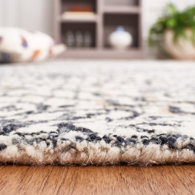 Ivory and Navy Tufted Wool Abstract Area Rug
