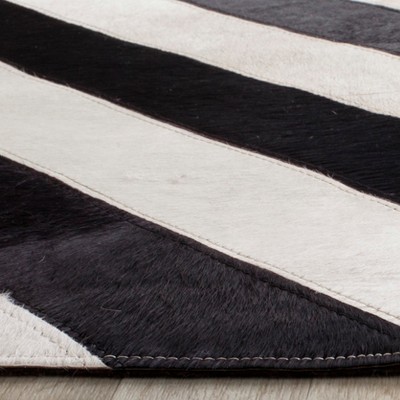 Handmade Black and White Geometric Cowhide Area Rug 4' x 6'