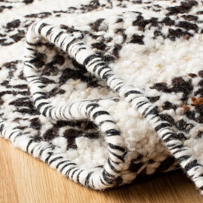 Black and Ivory Round Handwoven Wool Cotton Area Rug