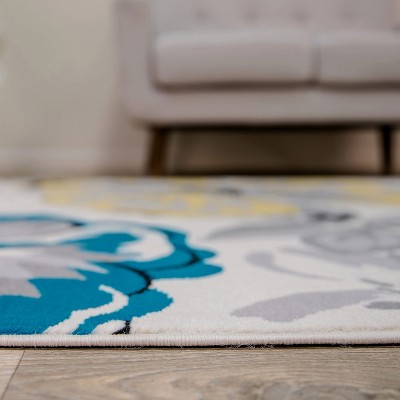 Cream Floral Synthetic 5' x 7' Reversible Area Rug