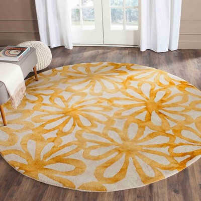 Handmade Round Beige and Gold Wool Area Rug