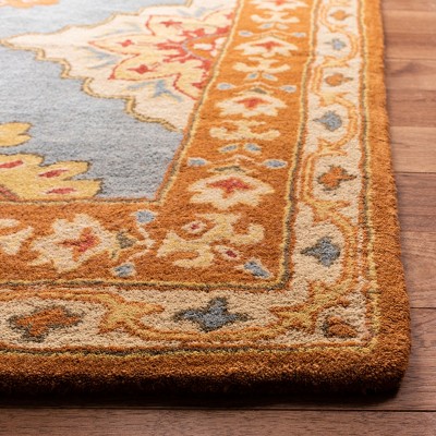 Hand-Tufted Blue and Rust Wool 5' x 8' Area Rug