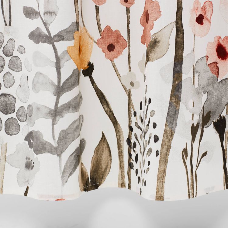 A white colored curtain with a floral pattern in shades of gray, pink, and orange.