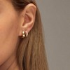 Small gold hoop earrings set for women with diamond pave and sterling silver posts. - 2 of 4