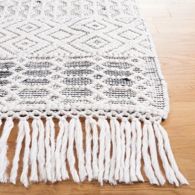 Handmade Black and Ivory Round Tufted Shag Rug