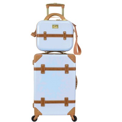 white and tan luggage set