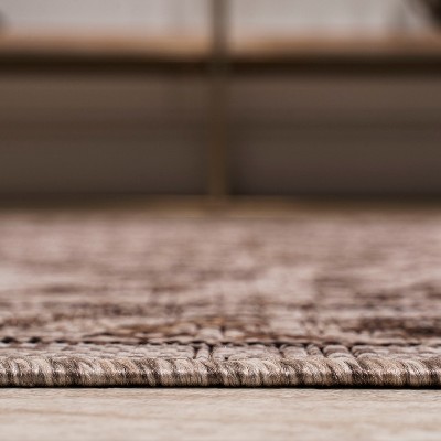 Ivory and Brown Medallion 8' x 10' Synthetic Rug