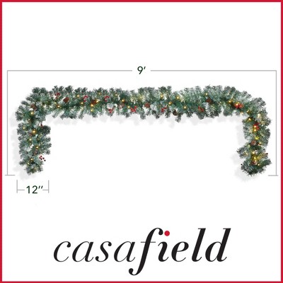 Casafield Pre-Lit Artificial Christmas Garland, 9FT Pre-Decorated Snow-Flocked Garland with 100 White Lights, Pine Cones, Berries Holiday Décor