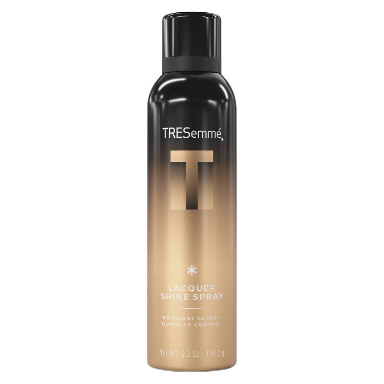 Black and gold colored hairspray can with "TRESemmé Lacquer Shine Spray" and "Brilliant Gloss + Humidity Control" text, containing 5.3 oz (150.2 g).