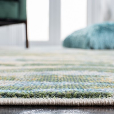 Lillian Blue and Green Floral Synthetic Area Rug