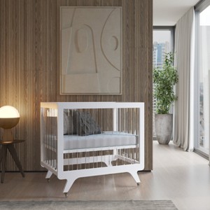 MelO Caress V-leg Foldable Crib, Modern Acrylic Frame with 3 Height Levels, Easy Fold & Smooth Rolling Wheels – Pure White - 1 of 3