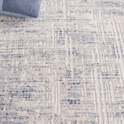 Ivory and Blue Synthetic Easy Care Area Rug