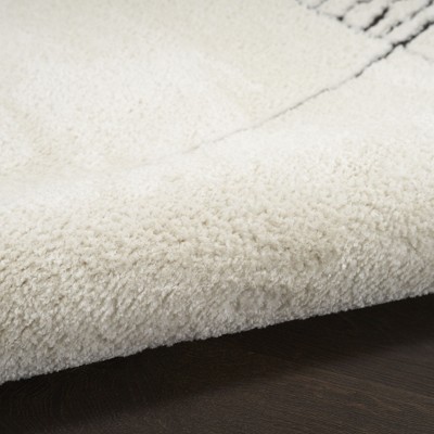 Black and Ivory Abstract Synthetic 8' x 10' Area Rug