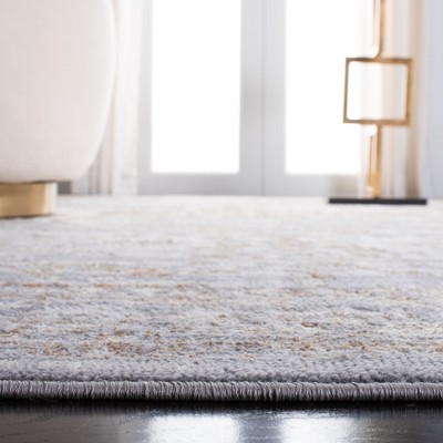 Abstract Gray and Gold 4'5" x 6'5" Synthetic Area Rug