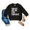 The Juniper Shop Snacks Are My Love Language Toddler Graphic Sweatshirt - 2 of 2