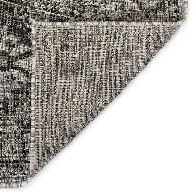 Carmel 24" Black Synthetic Flat Woven Floral Rug