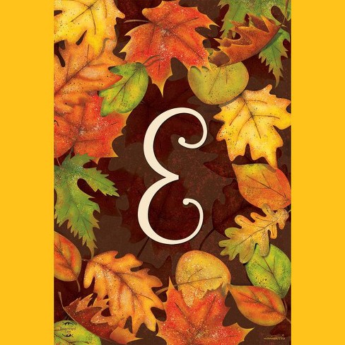 Letter j monogram with orange colored flowers and leaves