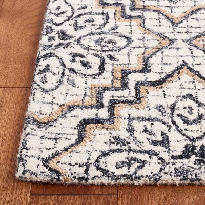Ivory and Navy Tufted Wool Abstract Area Rug