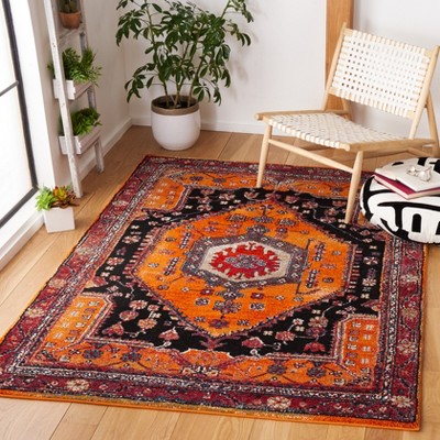 Vintage Orange and Black Synthetic 4' x 6' Area Rug