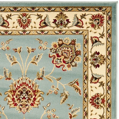 Ivory and Blue Floral Synthetic 4' x 6' Rectangular Rug
