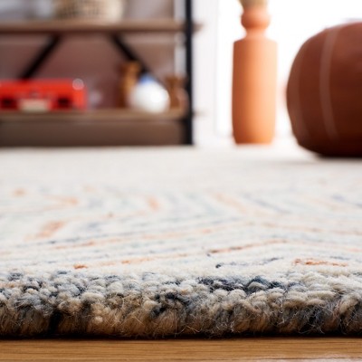 Capri Blue and Rust Hand-Tufted Wool Area Rug 6' x 9'