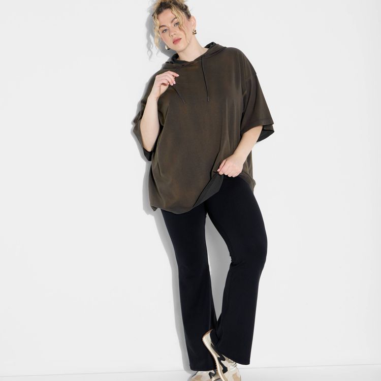 A brown colored oversized t-shirt with short sleeves and a hood.