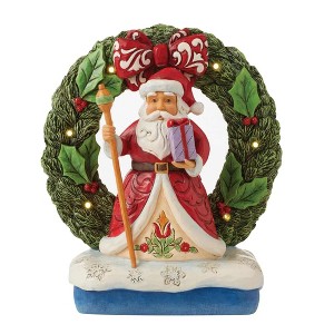 Jim Shore 7.0 Inch Believe In The Magic Of Christmas Santa By Light-Up Wreath Figurines - 1 of 3
