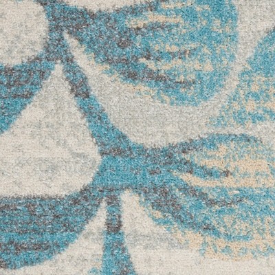 Ivory and Turquoise Floral Synthetic 6' x 9' Area Rug