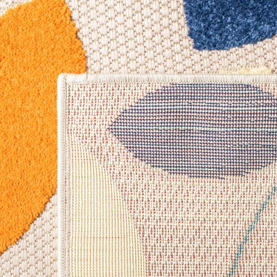 Ivory and Green Geometric Synthetic Indoor/Outdoor Rug