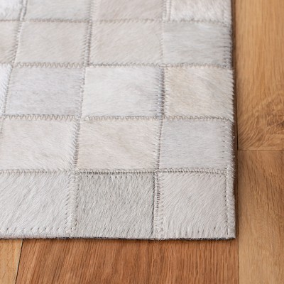 Handmade Black and Ivory Geometric Cowhide Area Rug