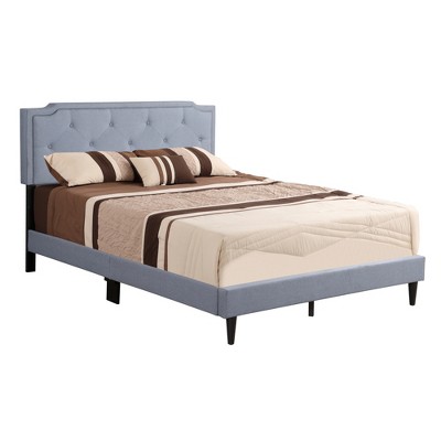 Blue upholstered bed with headboard and low-profile footboard