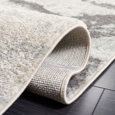 Ivory Elegance 63" Hand-Knotted Boho-Chic Synthetic Area Rug