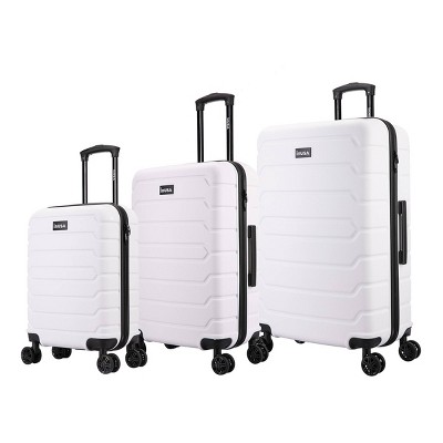 white hardside luggage