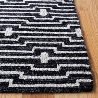 Ivory and Charcoal Round Tufted Wool Rug