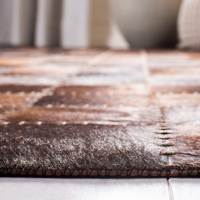 Handmade Brown and Beige Geometric Cowhide Area Rug