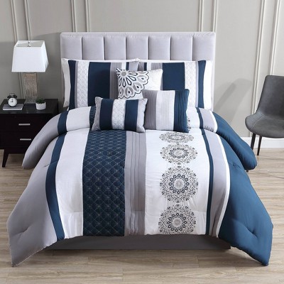 Photo 1 of Queen 7 pieces Crenshaw Comforter Set - Riverbrook Home. Embroidered Medallions Pieced with Color Banding in blue and gray
7 Piece Set includes 1 Comforter, 2 Shams, 1 Bedskirt, and 3 Bonus Embroidered Decorative Pillows. Embroidered and Quilted Pintuck T