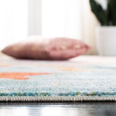 Lillian Blue and Orange Floral Synthetic Area Rug