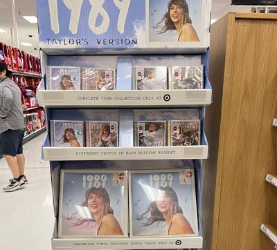 Each Target Exclusive 1989 (Taylor's Version) Deluxe CD comes with: – A  collectible lyric booklet with never-before-seen photos, different…