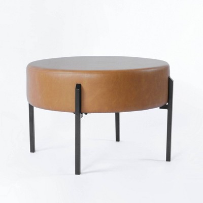 Carmel Faux Leather Round Ottoman with Black Metal Legs