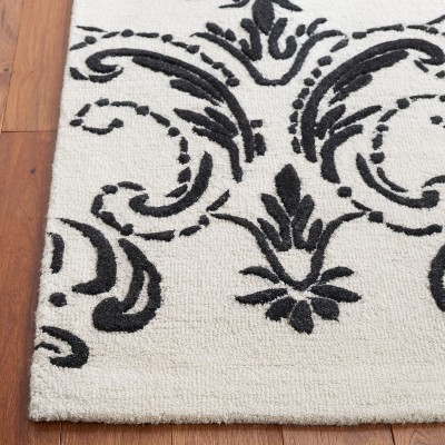 Ivory and Black Hand-Tufted Wool Floral Area Rug, 5' x 8'