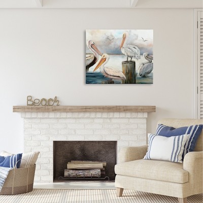 Pelicans Perched on Cloudy Horizon Canvas Wall Art