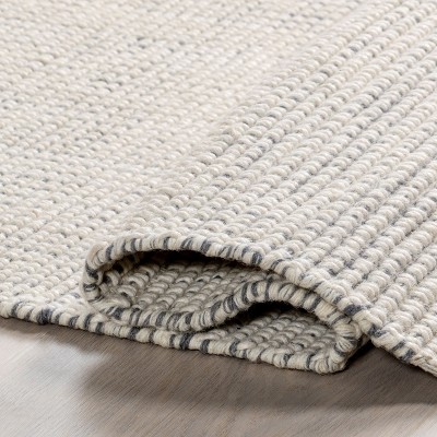 Handmade Ivory Wool Rectangular Area Rug with Fringe