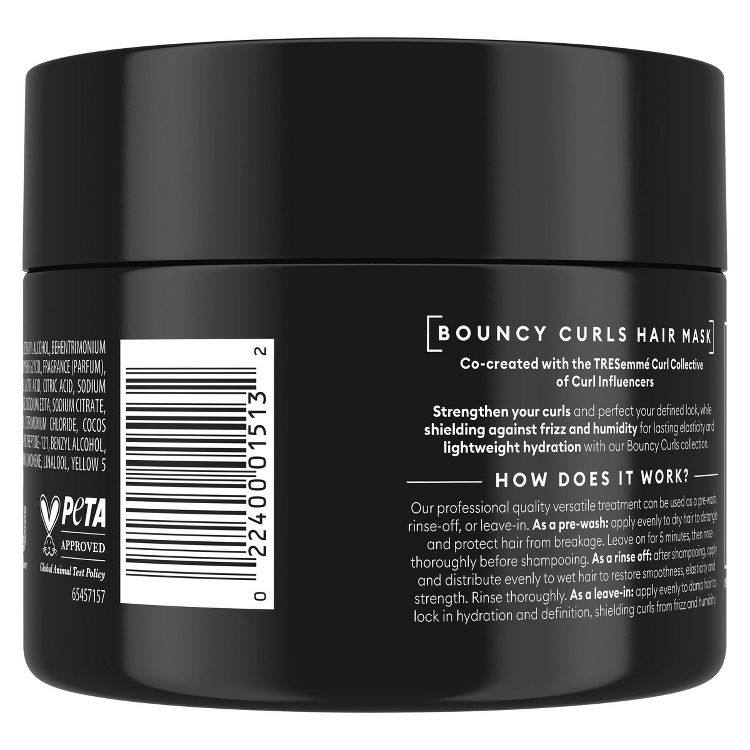 Black colored jar labeled "Bouncy Curls Hair Mask" with text detailing its benefits and usage instructions.