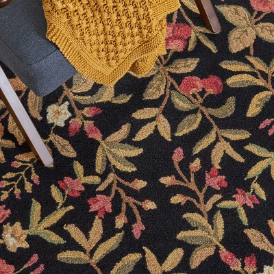 Handmade Black Floral Wool Oval Tufted Rug