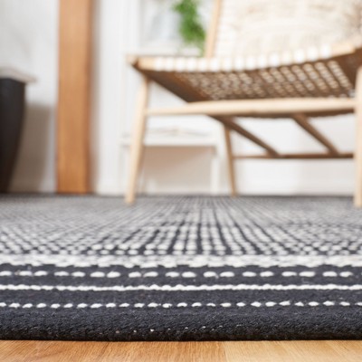 Handmade Black and Ivory Wool Flat Woven Rectangular Rug 4' x 6'