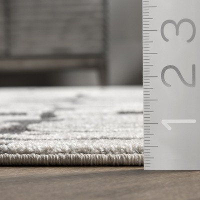 Ivory Abstract Synthetic 5' x 7' Easy Care Area Rug