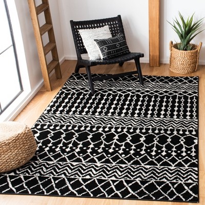 Ivory and Black Hand-knotted Synthetic Area Rug, 5'3" x 7'6"
