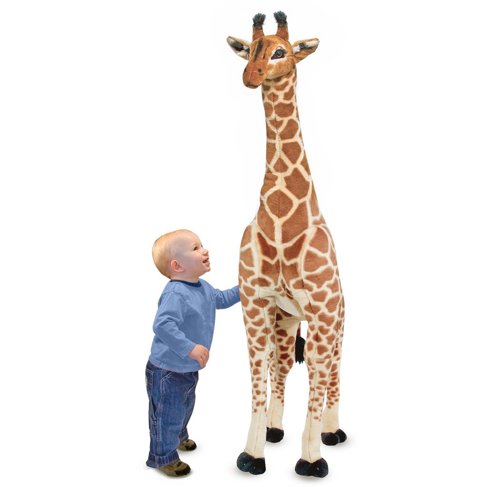 Melissa & Doug Giant Giraffe - Lifelike Stuffed Animal This majestic, giant giraffe transforms a child’s nursery or bedroom into an African savanna. It is sure to bring a smile to everyone’s face with its plush coat, patterned closely after the real thing. It features graceful, sturdy, wire-framed legs and a long neck that make it ideal for hugs or posing during playtime. This toy's cuddly appearance with its long, lifelike eyelashes will have kids running to hug it time and again. And because of its sturdy construction, the giraffe can take all the hugs your child has to give. Standing over four feet tall, the giraffe is likely to tower over all the other toys in the home and make a 'big' statement! This eye-catching giraffe is a great accessory in a nursery, or any decor addition. Our 4-foot tall giraffe is built with a durable construction and a surface material that is washable. Melissa and Doug makes high-quality stuffed animals for girls and boys of all ages, and this Giant Giraffe Lifelike Stuffed Animal makes a great gift for kids 3 years and up. Add the Melissa and Doug Burrow Bunny Stuffed Rabbit to round out the cuddly pretend play (and screen-free!) experience. When fully unpacked, our huge stuffed giraffe measures 53  x 31  x 14  and weighs 6.8 pounds. For more than 30 years, Melissa and Doug has created beautifully designed imagination- and creativity-sparking products that NBC News called “the gold standard in early childhood play.” Today, Melissa and Doug is proudly partnering with the American Academy of Pediatrics to foster early brain development and help children build important life skills through play.
