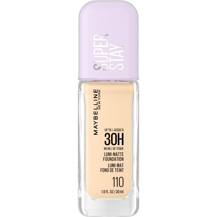 A bottle of Maybelline Super Stay Lumi-Matte Liquid Foundation in shade 110, featuring a light purple cap and clear bottle displaying the product label and volume of 1 fl oz.