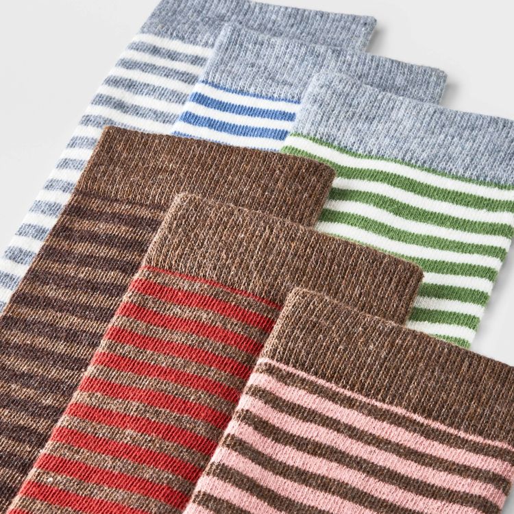 Six pairs of striped socks in various colors including blue, green, brown, red, and pink, arranged in a row.